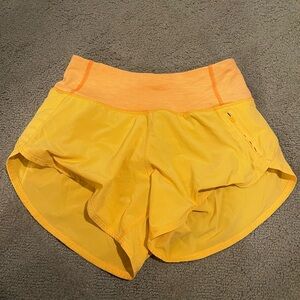 Orange outdoor voices Hudson shorts 4”